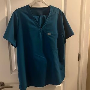 CARIBBEAN BLUE SCRUB SET. TOP IS ONE POCKET, BOTTOMS ARE SKINNY PANT.